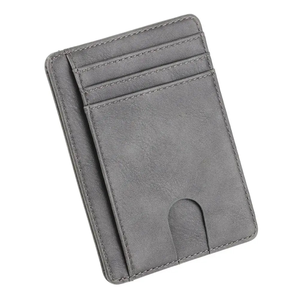 A slim gray leather card holder wallet with multiple slots and a cutout for a card.