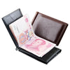 A black leather wallet is open, displaying a pink banknote and a folded leather card.