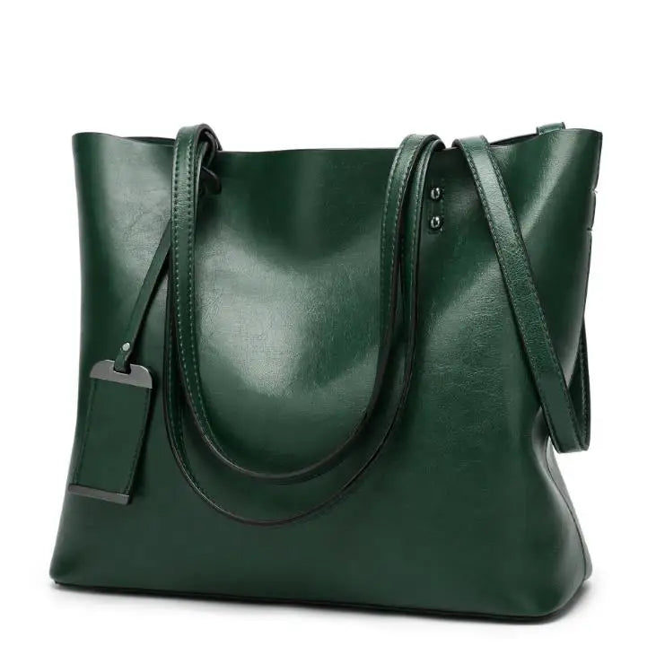 A dark green waxed leather bucket bag with dual straps shown from the front.