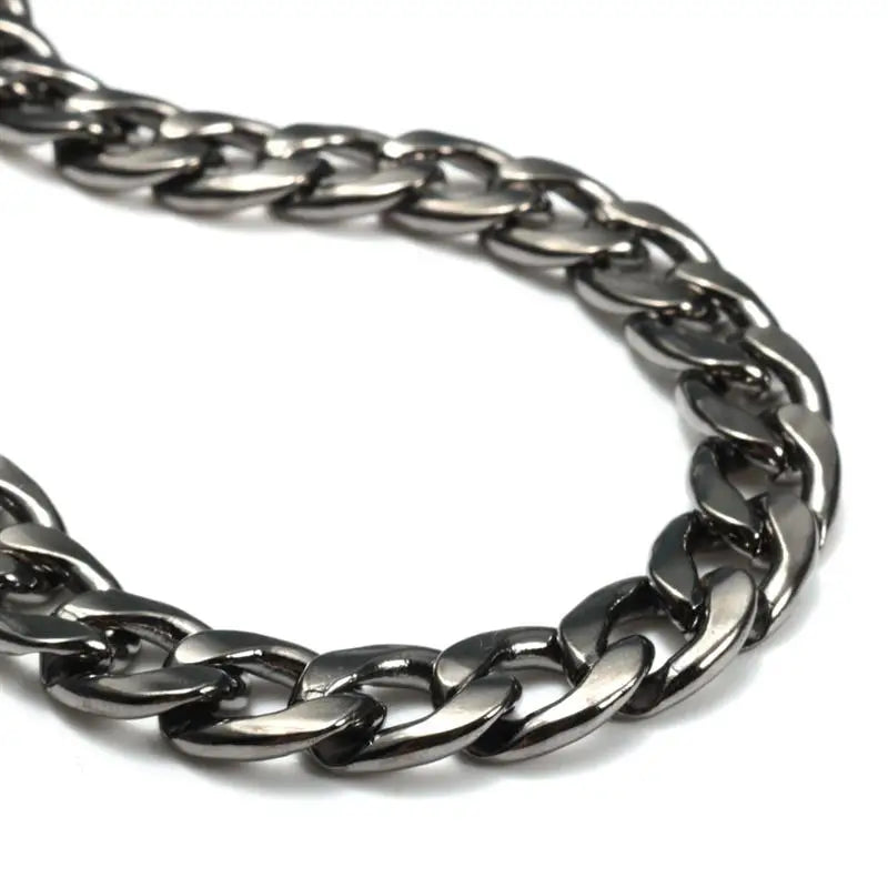 A close-up view of a silver metal bag chain strap with links and clips.