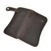 A dark brown genuine leather bifold wallet with a stitched flap and a metal chain attached.