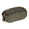 A dark olive green canvas messenger bag with brown leather trim and a woven logo detail.