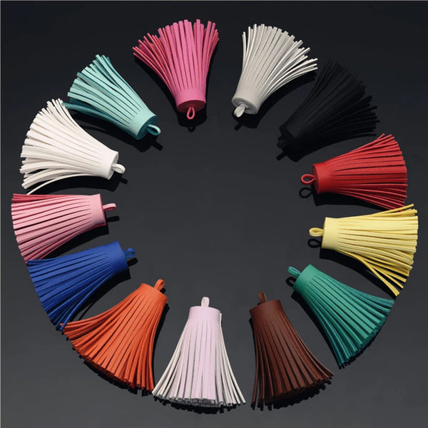 A circular arrangement of various colored leather tassel fringe craft supplies.