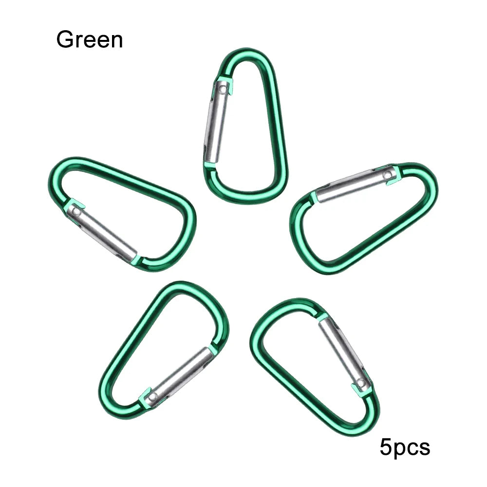 A set of five green aluminum carabiner hooks.