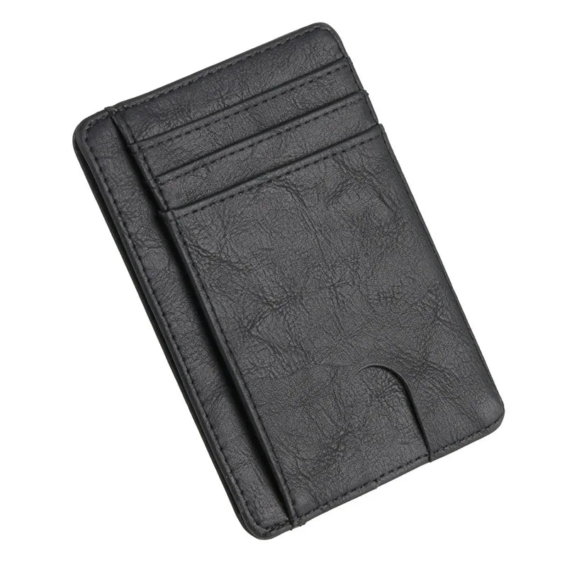 A black slim leather wallet with stitched lines shown from above.