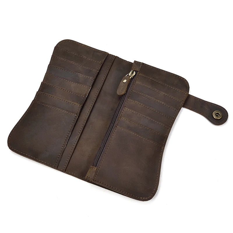 A brown genuine leather bifold wallet with a zipper and a leather strap.