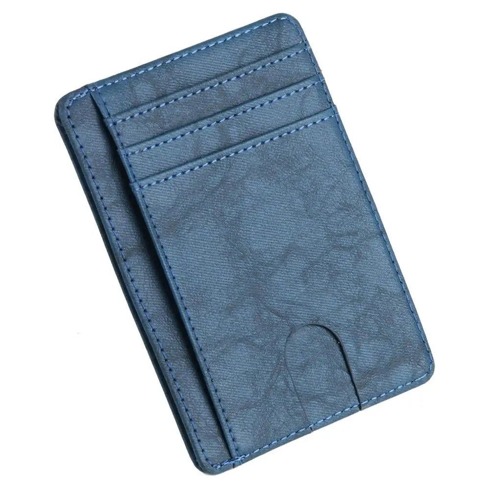 A dark blue leather card holder wallet with stitched edges and a slim design.