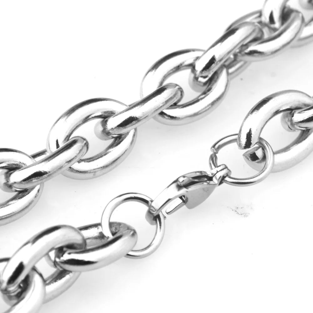 A close-up of a stainless steel rolo link chain necklace lying on a white background.