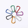 A collection of colorful aluminum carabiner key rings in various colors like green, red, blue, and purple.