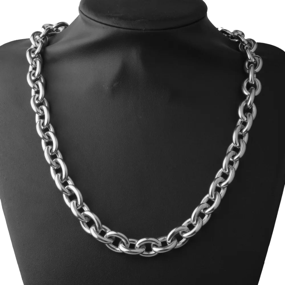 A silver stainless steel rolo link chain necklace displayed on a black mannequin neck.