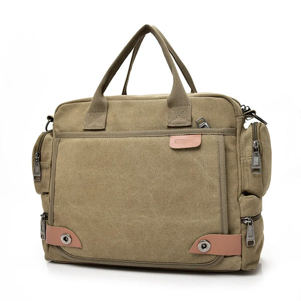 A tan canvas crossbody messenger bag with brown leather accents and multiple zippered compartments.