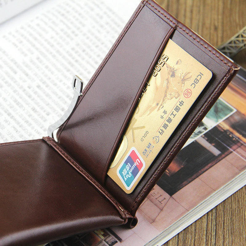 A brown leather wallet with an ID card visible inside, resting on a wooden surface.