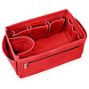 A red collapsible felt cosmetic organizer pouch with multiple compartments and a zipper.