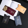 Several RFID blocking card sleeves in various colors are displayed on a black surface.