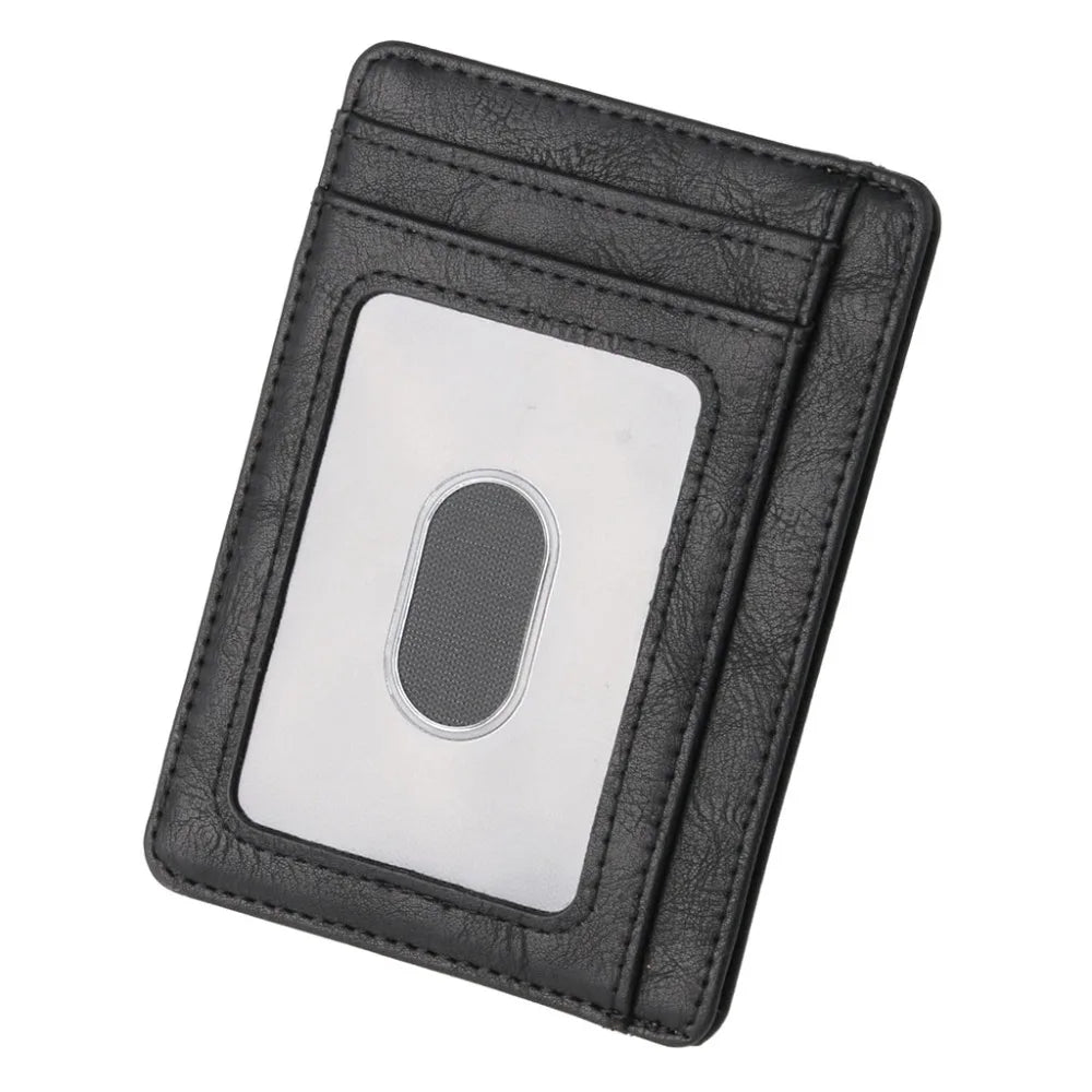 A black leather card holder wallet with a clear window displaying an RFID blocking feature.