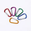 A collection of colorful aluminum carabiner key rings in various colors like red, purple, green, and blue.