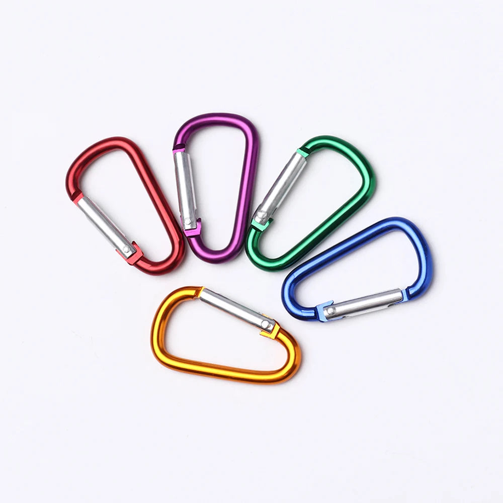 A collection of colorful aluminum carabiner key rings in various colors like red, purple, green, and blue.