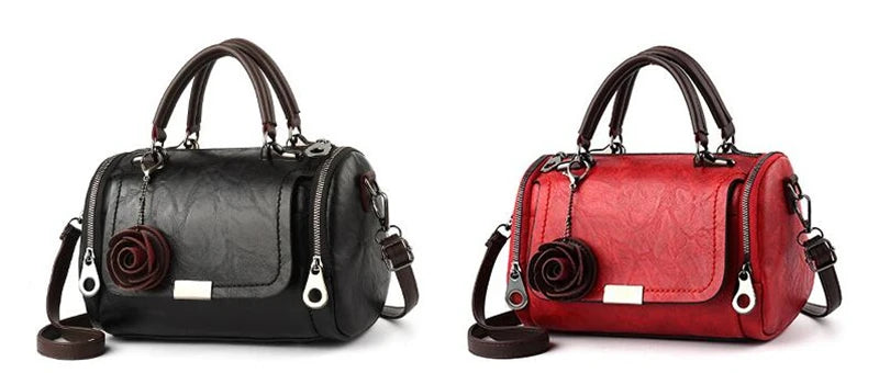 Schwarze Leder-Blumen-Anhänger-Schultertasche und rote Leder-Blumen-Anhänger-Schultertasche