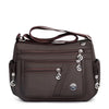 A dark brown waterproof nylon crossbody tote bag for women.