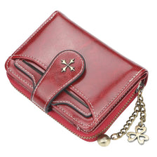 A maroon PU leather compact wallet with a flap closure and a gold-toned chain attached.