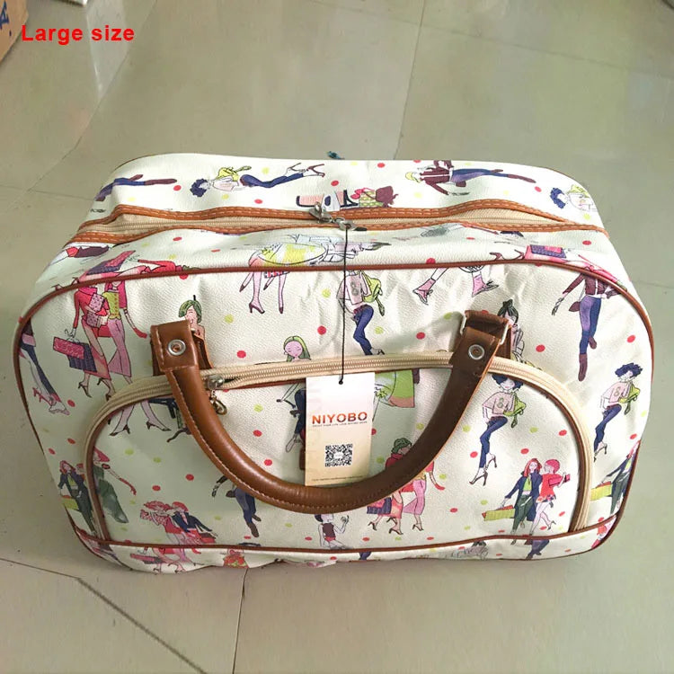 A large white and multi-colored patterned PU leather travel duffel bag with brown leather handles.