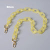 A yellow adjustable detachable chain shoulder bag is displayed against a gray background.