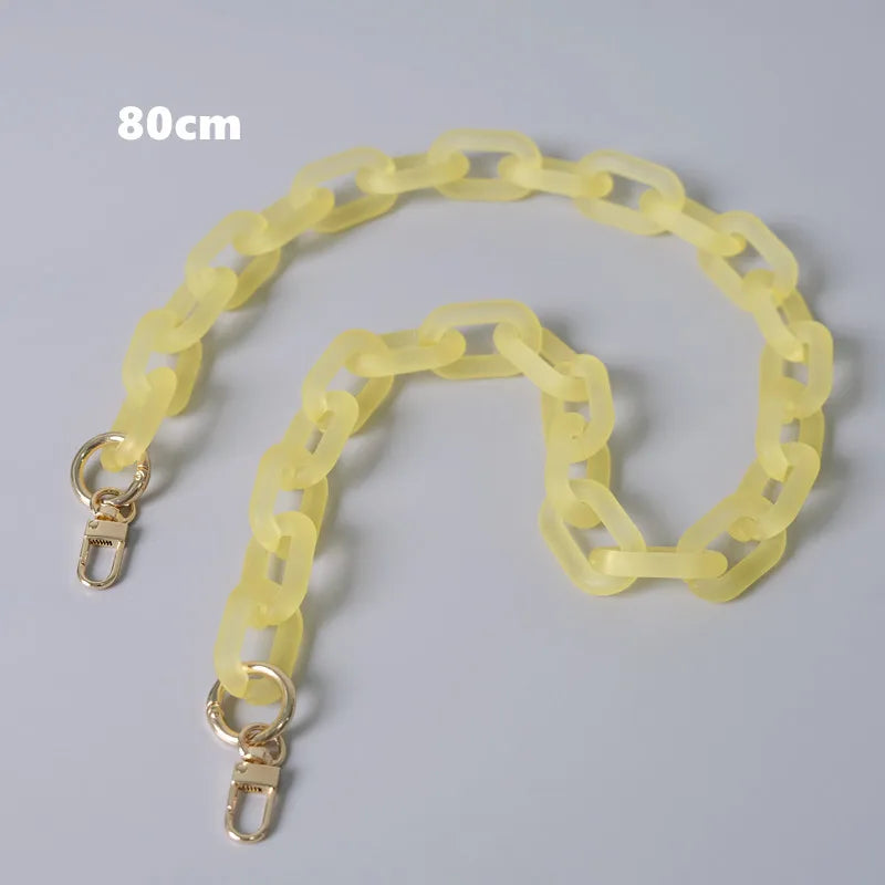 A yellow adjustable detachable chain shoulder bag is displayed against a gray background.