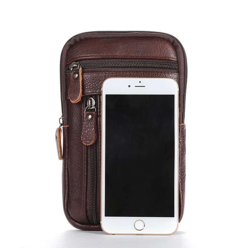 A brown genuine leather crossbody phone pouch with a flap and hardware, shown against a white background.