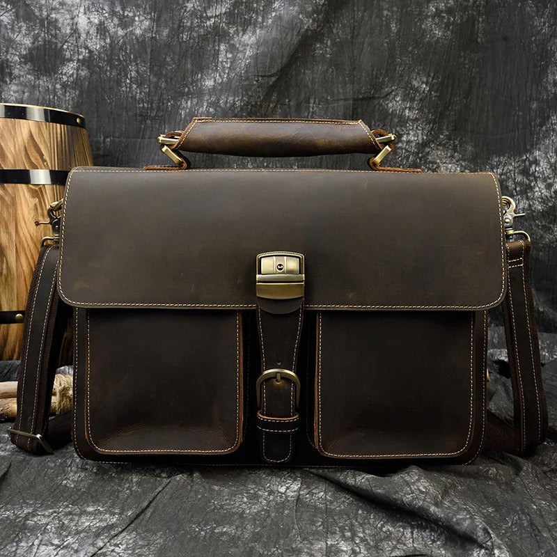 A dark brown vintage Crazy Horse leather briefcase with a flap closure and leather trim.