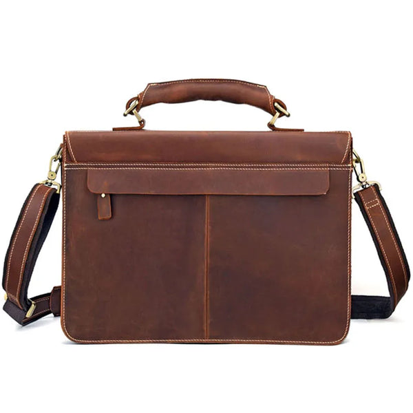 A brown vintage Crazy Horse leather briefcase with a padded handle and shoulder strap.