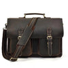 A dark brown vintage Crazy Horse leather briefcase with a handle and multiple compartments.
