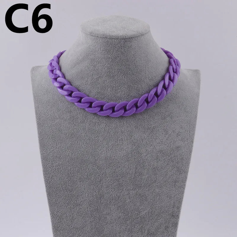 Purple acrylic link chain necklace displayed on a gray mannequin neck.