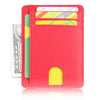 A bright pink leather card holder wallet with a cutout and several cards inside.
