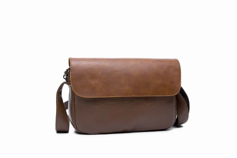 A brown retro PU leather crossbody shoulder bag for men shown against a white background.