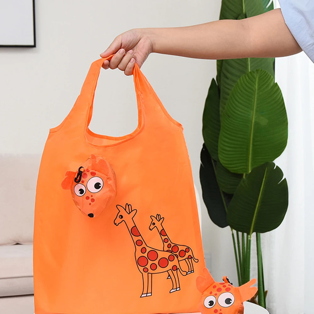 Sac de shopping orange avec des illustrations de girafes.