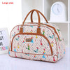 A large patterned PU leather travel duffel bag with brown handles resting on a white shelf.