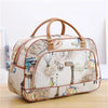 A beige PU leather travel duffel bag with brown handles and a map print design is shown on a wooden surface.