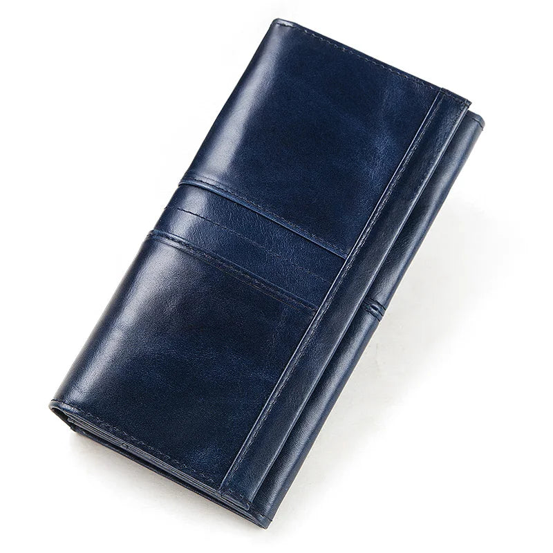 A dark navy genuine leather clutch wallet folded and displayed on a white background.