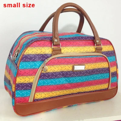 A small, striped PU leather travel duffel bag with brown handles and a pink, yellow, and blue pattern.