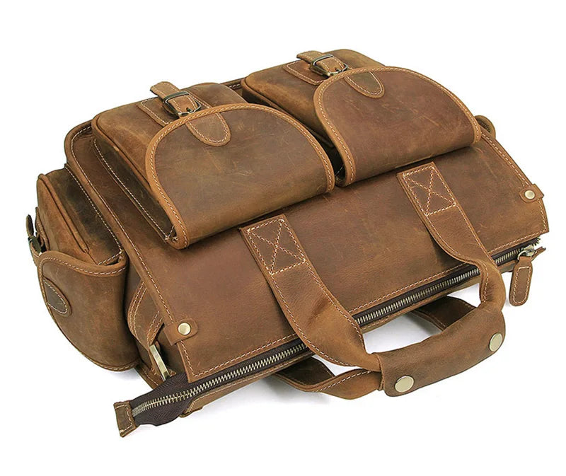 A brown genuine cowhide leather briefcase with padded compartments and leather straps.