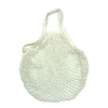 A light cream colored reusable organic cotton mesh grocery tote bag with a drawstring closure.