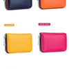 Four accordion card holder wallets in navy blue, orange, yellow, and rose red leather.
