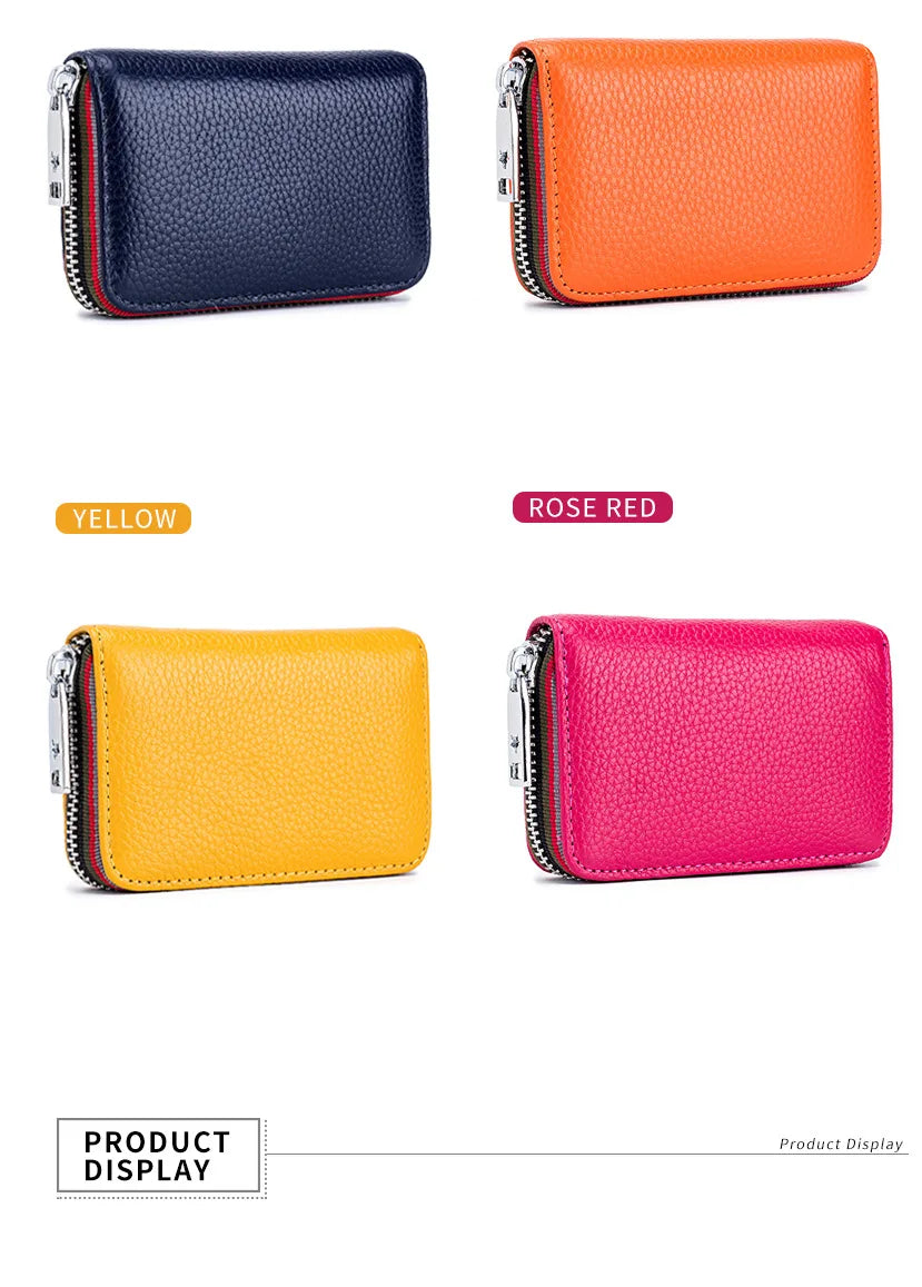 Four accordion card holder wallets in navy blue, orange, yellow, and rose red leather.