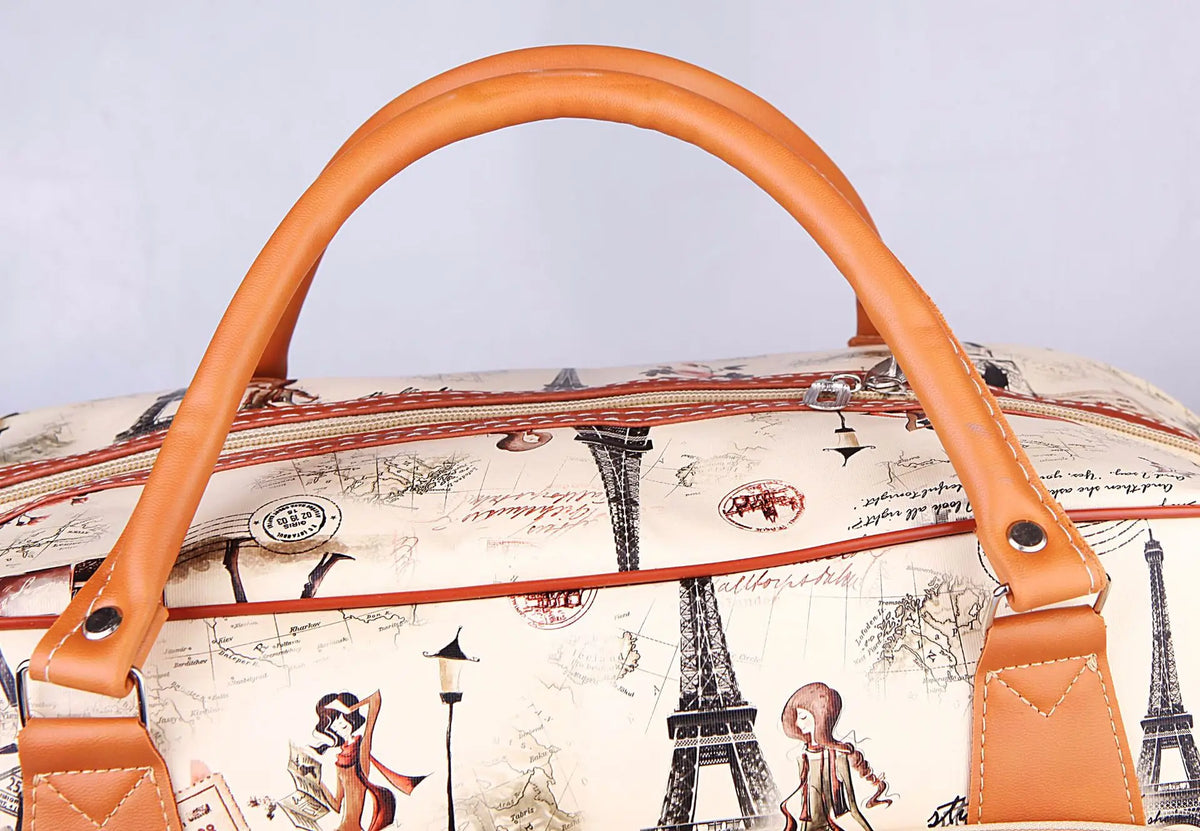 A tan PU leather travel duffel bag featuring a map print and Eiffel Tower illustrations.