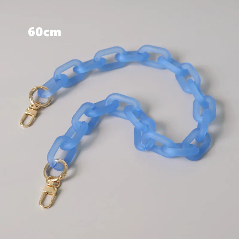 A light blue adjustable detachable chain shoulder bag is displayed on a gray background.