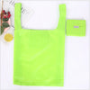 A bright lime green eco-friendly foldable shopping bag next to a small matching bag.