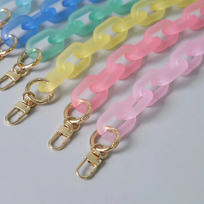 A collection of colorful, adjustable detachable chain shoulder bags in shades of blue, green, yellow, and pink.