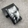 A black custom engraved cigarette case with a striking monochrome image of a bear.