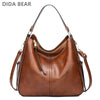 A brown vintage faux leather hobo shoulder bag with a zipper and leather strap.