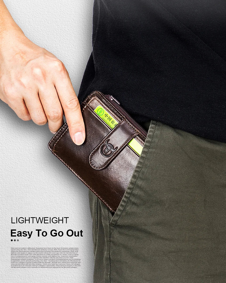 A hand holds a brown genuine leather RFID blocking card holder against a dark shirt and olive green pants.
